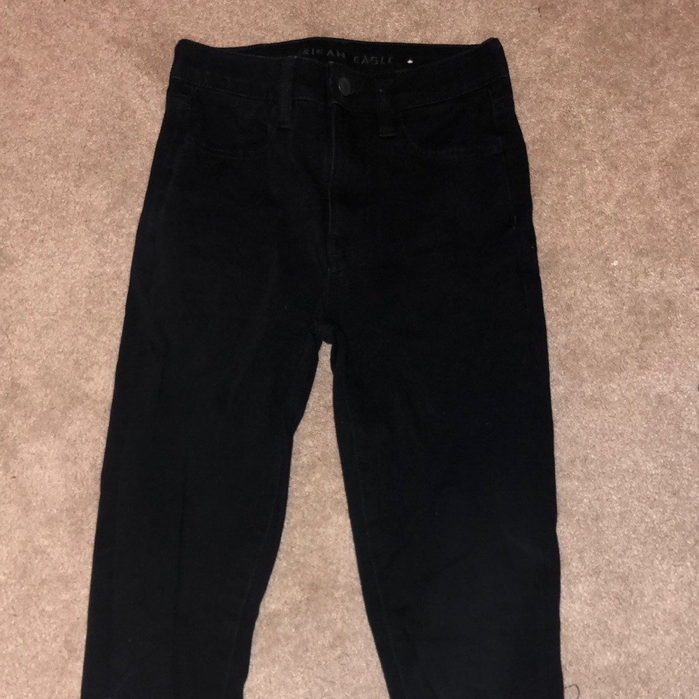 Black American eagle jeans with rips in the knees
